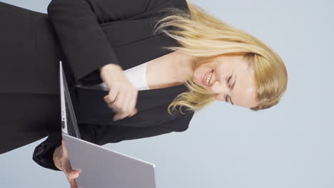 Vertical-video-of-Business-woman-looking-at-laptop-with-excitement.